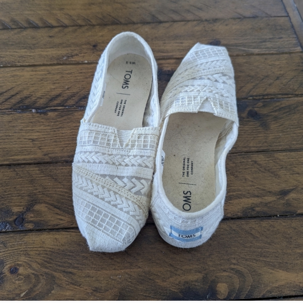 Women's off white slip on Toms shoes